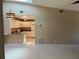 Bright living room with tile flooring, modern lighting, and view of kitchen at 3300 Loveland Blvd # 602, Punta Gorda, FL 33980