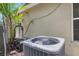 Exterior view of the home's AC unit with a generator located outside the home at 3322 Hampton St, Port Charlotte, FL 33948