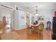 Inviting dining area with hardwood floors, chandelier lighting, and an open layout connecting to the kitchen and living spaces at 3322 Hampton St, Port Charlotte, FL 33948