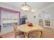 Bright dining room featuring a round table and light fixture, perfect for Gathering meals at 3322 Hampton St, Port Charlotte, FL 33948