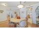 Dining room with round table and chairs, with view to the open floor plan at 3322 Hampton St, Port Charlotte, FL 33948