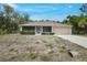 Charming single-story home featuring a well-maintained yard and attached garage at 3322 Hampton St, Port Charlotte, FL 33948