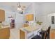 Eat-in kitchen area with bright white cabinets and high ceilings at 3322 Hampton St, Port Charlotte, FL 33948