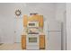 Bright kitchen featuring white appliances and ample cabinet space at 3322 Hampton St, Port Charlotte, FL 33948