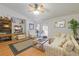 Inviting living room with vaulted ceiling, fan, comfortable furniture, and sliding glass doors at 3322 Hampton St, Port Charlotte, FL 33948
