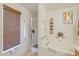 Bright main bathroom showcasing a soaking tub and separate glass-enclosed shower, enhanced by natural light and clean finishes at 3322 Hampton St, Port Charlotte, FL 33948