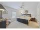 Spacious main bedroom showcasing neutral decor, a ceiling fan, and ample natural light from the window at 3322 Hampton St, Port Charlotte, FL 33948