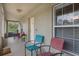 View of the covered porch area with seating space to enjoy the outdoors at 3322 Hampton St, Port Charlotte, FL 33948