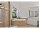 Bathroom features a large soaking tub, separate glass shower, and vanity at 3393 S Haberland Blvd, North Port, FL 34288