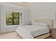 Bedroom with a window seat, natural light, and hardwood floors at 3393 S Haberland Blvd, North Port, FL 34288
