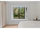 Bedroom with a window seat, natural light, and hardwood floors at 3393 S Haberland Blvd, North Port, FL 34288