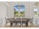 Bright dining room boasting a sleek table and modern chandelier, perfect for elegant gatherings at 3393 S Haberland Blvd, North Port, FL 34288