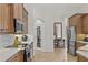 Bright kitchen with stainless steel appliances and custom wood cabinetry at 3393 S Haberland Blvd, North Port, FL 34288