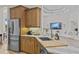 Modern kitchen with stainless steel appliances and marble countertops, perfect for culinary enthusiasts at 3393 S Haberland Blvd, North Port, FL 34288