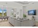 Open-concept living room with dining area, showcasing a modern design and comfortable furnishings at 3393 S Haberland Blvd, North Port, FL 34288