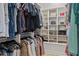 Spacious walk-in closet with custom shelving for clothes, shoes, and accessories at 3393 S Haberland Blvd, North Port, FL 34288