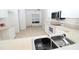 Spacious kitchen featuring white appliances, ample counter space and tile floors, ready for customization at 3803 Albacete Cir # 64, Punta Gorda, FL 33950