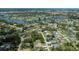 An aerial view showing property location in a beautiful neighborhood with lakes and mature trees at 3960 Magara Ter, North Port, FL 34287