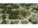 Aerial view of home highlighting landscaping, swimming pool and the surrounding neighborhood at 3960 Magara Ter, North Port, FL 34287