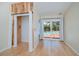 Bedroom with hardwood floors, a walk-in closet, and sliding doors leading to the pool at 3960 Magara Ter, North Port, FL 34287