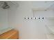 Walk-in closet with wire shelving and a hanging rack with black hooks at 3960 Magara Ter, North Port, FL 34287
