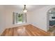 Bright dining room showcasing hardwood floors and a view of the backyard at 3960 Magara Ter, North Port, FL 34287
