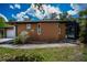 Home exterior features stucco siding, and access to the pool area at 3960 Magara Ter, North Port, FL 34287