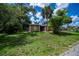 Exterior view showcasing a maturely landscaped front lawn with a charming home at 3960 Magara Ter, North Port, FL 34287