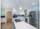 Contemporary kitchen featuring a center island, stainless appliances and light blue walls at 3960 Magara Ter, North Port, FL 34287
