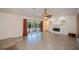 Inviting living area with fireplace, built-ins, and sliding doors opening to the pool at 3960 Magara Ter, North Port, FL 34287