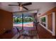 Enclosed patio area with ceiling fan, outdoor seating, and view of the pool at 3960 Magara Ter, North Port, FL 34287
