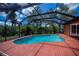 Backyard pool with a screened enclosure at 3960 Magara Ter, North Port, FL 34287