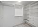 Organized walk-in closet with shelving, drawers, and hanging rods for ample storage at 3960 Magara Ter, North Port, FL 34287