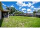 Large backyard features a playground and a well-maintained lawn, offering endless possibilities at 4294 Wooley Ave, North Port, FL 34287