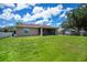 This home features a vast backyard with a playground, perfect for Gathering fun and outdoor activities at 4294 Wooley Ave, North Port, FL 34287