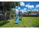Well-maintained backyard includes a playground, perfect for entertainment and outdoor enjoyment at 4294 Wooley Ave, North Port, FL 34287