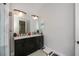 Bathroom featuring double vanity with marble countertop and black fixtures at 4294 Wooley Ave, North Port, FL 34287