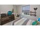 Bedroom featuring a window, seating, and neutral paint at 4294 Wooley Ave, North Port, FL 34287