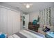 Bedroom with large closet, ceiling fan, and plenty of storage at 4294 Wooley Ave, North Port, FL 34287