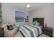 Cozy bedroom featuring neutral paint, ceiling fan, and decorative accents at 4294 Wooley Ave, North Port, FL 34287