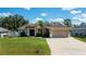 Lovely single-Gathering house featuring a well-kept lawn and an attached two-car garage at 4294 Wooley Ave, North Port, FL 34287