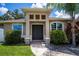Inviting front entrance with a striking double door and attractive stone pillars at 4294 Wooley Ave, North Port, FL 34287
