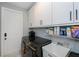 Laundry room featuring a sink and cabinetry for storage space at 4294 Wooley Ave, North Port, FL 34287
