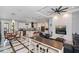 Open-concept living area with chef's kitchen, breakfast nook, and stylish fireplace feature wall at 4294 Wooley Ave, North Port, FL 34287