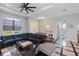 Chic living space boasting a modern fan, neutral walls, and direct access to the en-suite bathroom at 4294 Wooley Ave, North Port, FL 34287