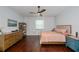 The main bedroom with hardwood floors is well-lit from natural light, and has ample space for furnishings at 4294 Wooley Ave, North Port, FL 34287