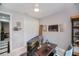 Home office features a ceiling fan, closet and natural lighting at 4294 Wooley Ave, North Port, FL 34287