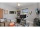 Home office with natural light, ceiling fan, and built-in shelving at 4294 Wooley Ave, North Port, FL 34287