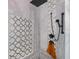 Modern shower with rain shower head and mosaic tile accent wall at 4294 Wooley Ave, North Port, FL 34287