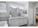 Bathroom featuring a double sink vanity, soaking tub, with a separate shower at 43249 Treadway Dr, Punta Gorda, FL 33982